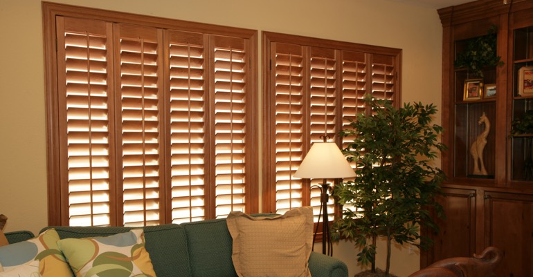 Wood shutters in Houston living room.